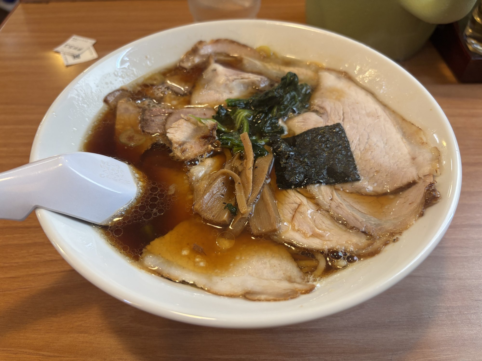 A bowl of shoyu chashu-men from Ramen Higuma's Ojiya main shop, topped with sliced chashu pork, menma and green onion